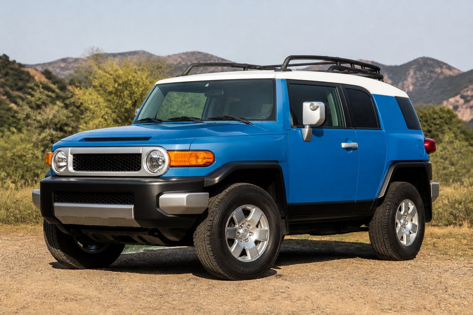 A Toyota FJ Cruiser parked outdoors with natural surroundings.