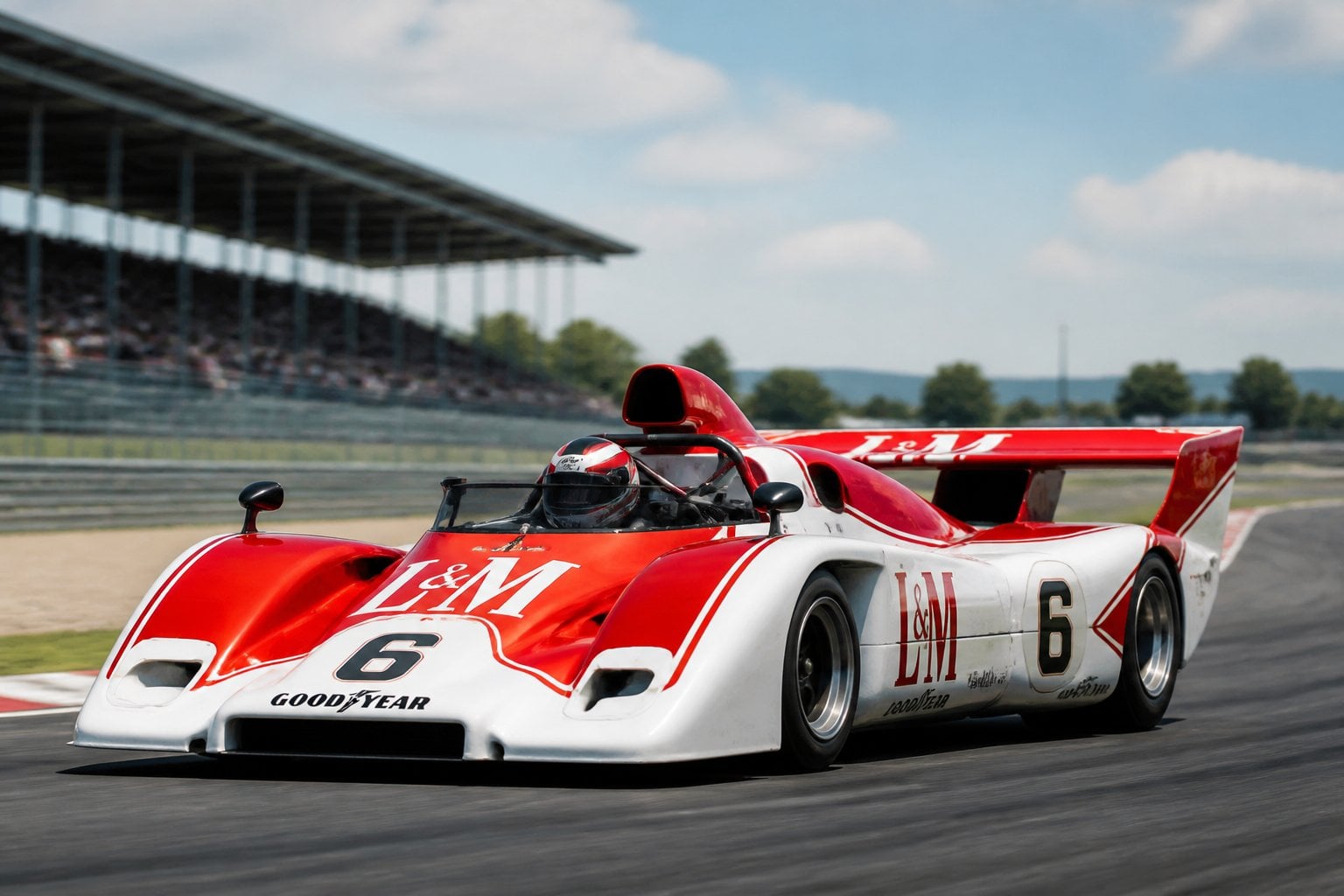 A Porsche 917/30 Can-Am race car on a racetrack with blurred grandstands in the background.