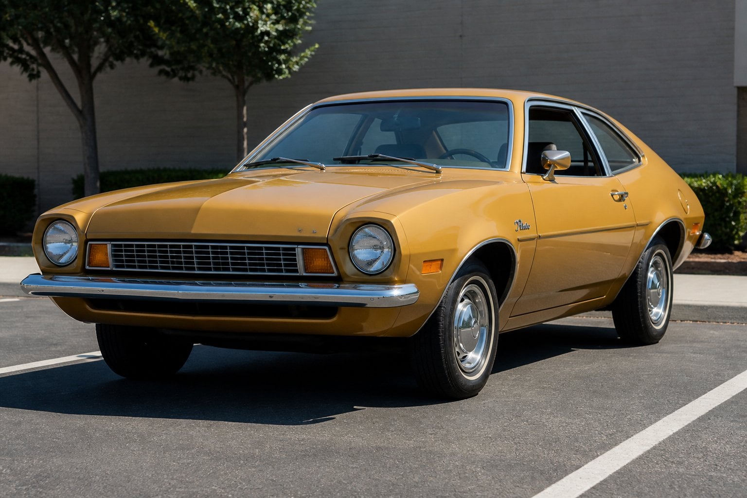 A vintage 1970s Ford Pinto car parked outdoors on a sunny day.