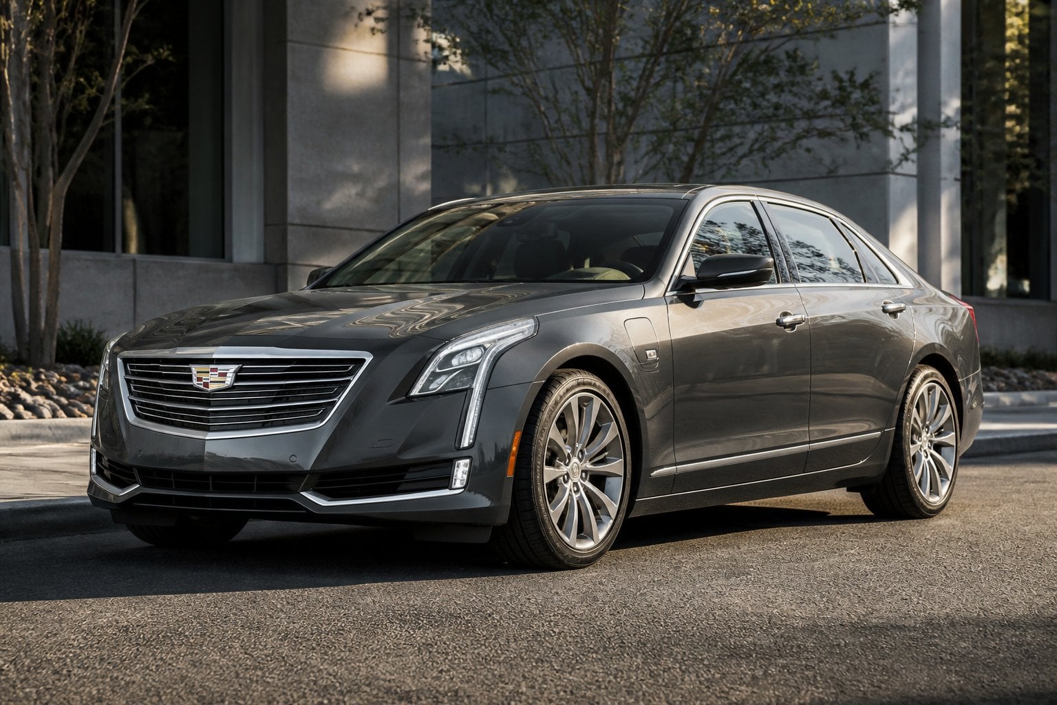 A Cadillac CT6 plug-in hybrid sedan parked on a modern city street.