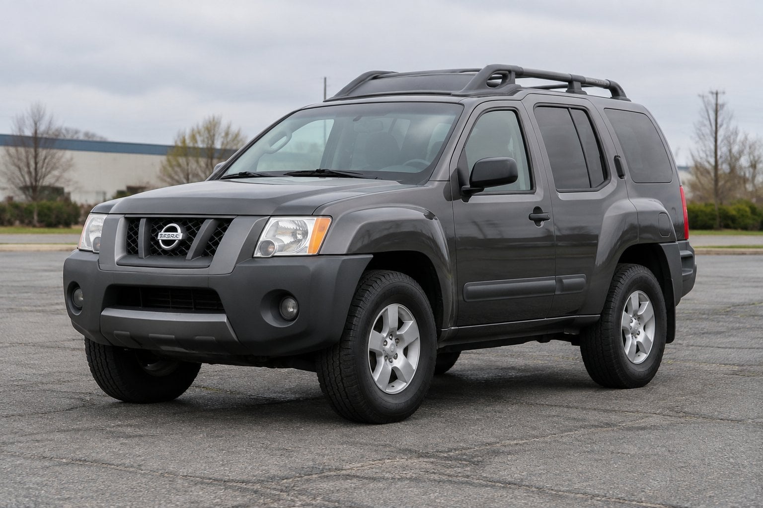 A 2005 Nissan Xterra parked on an asphalt lot, viewed from the front at an angle.