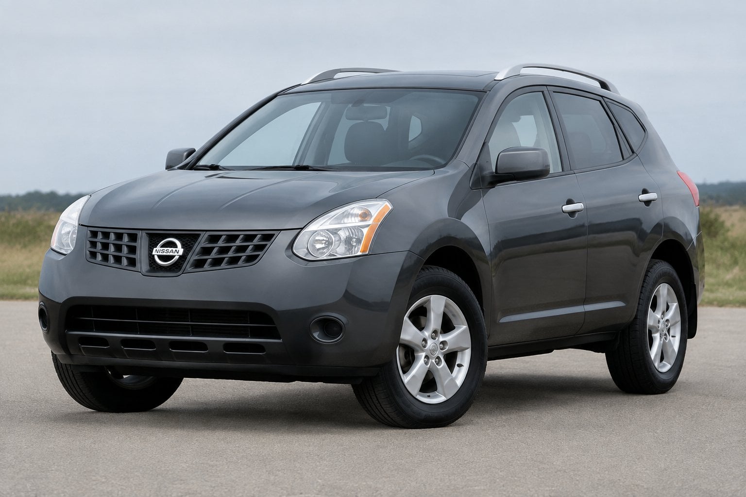 A 2008 Nissan Rogue compact SUV parked outdoors in a three-quarter front view.