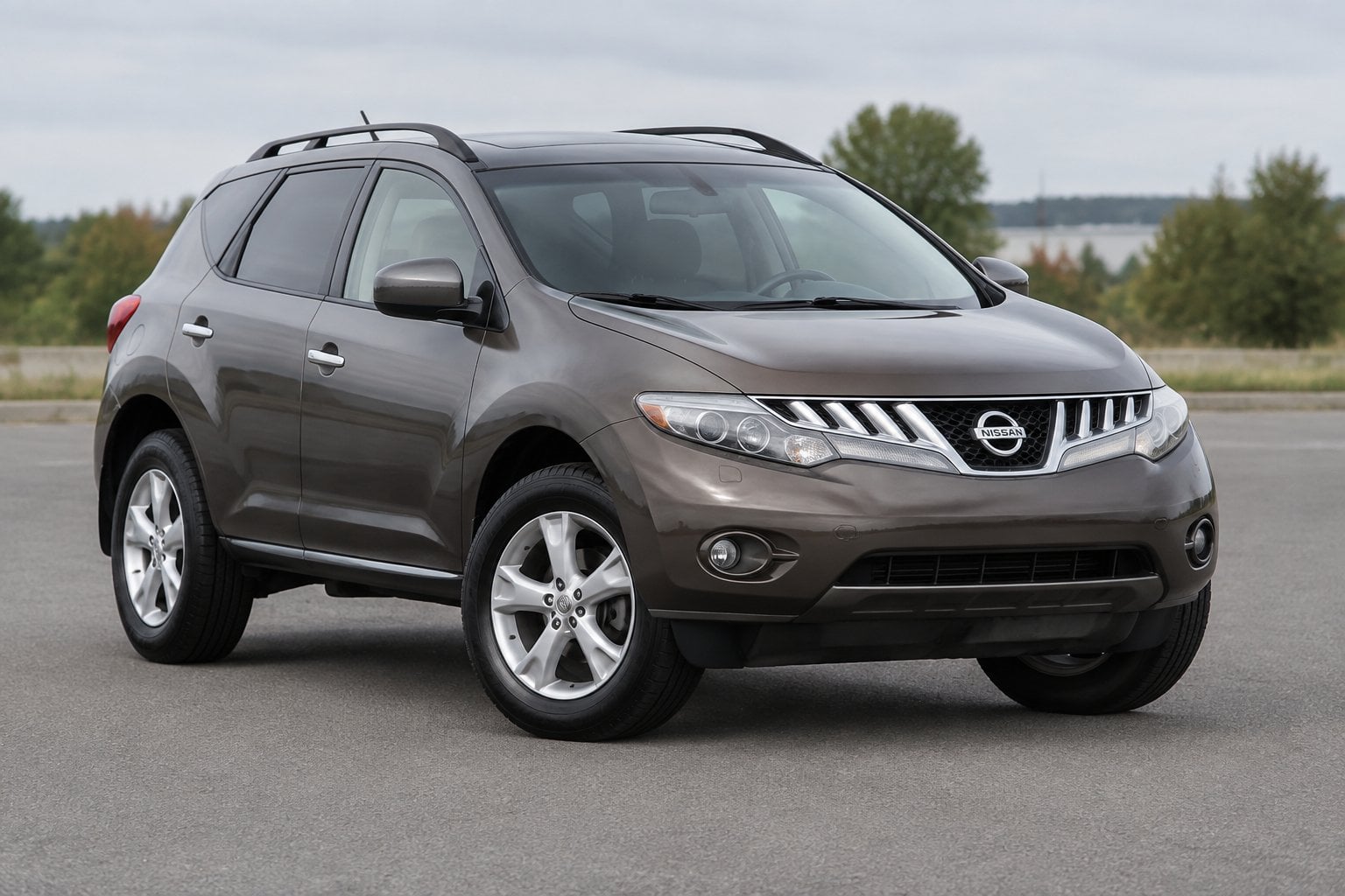 A 2010 Nissan Murano crossover SUV parked outdoors on a paved surface.