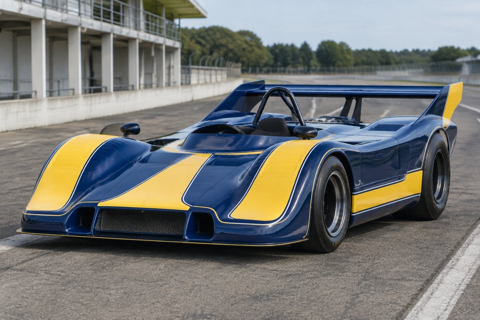 A vintage Porsche race car parked on a racetrack.