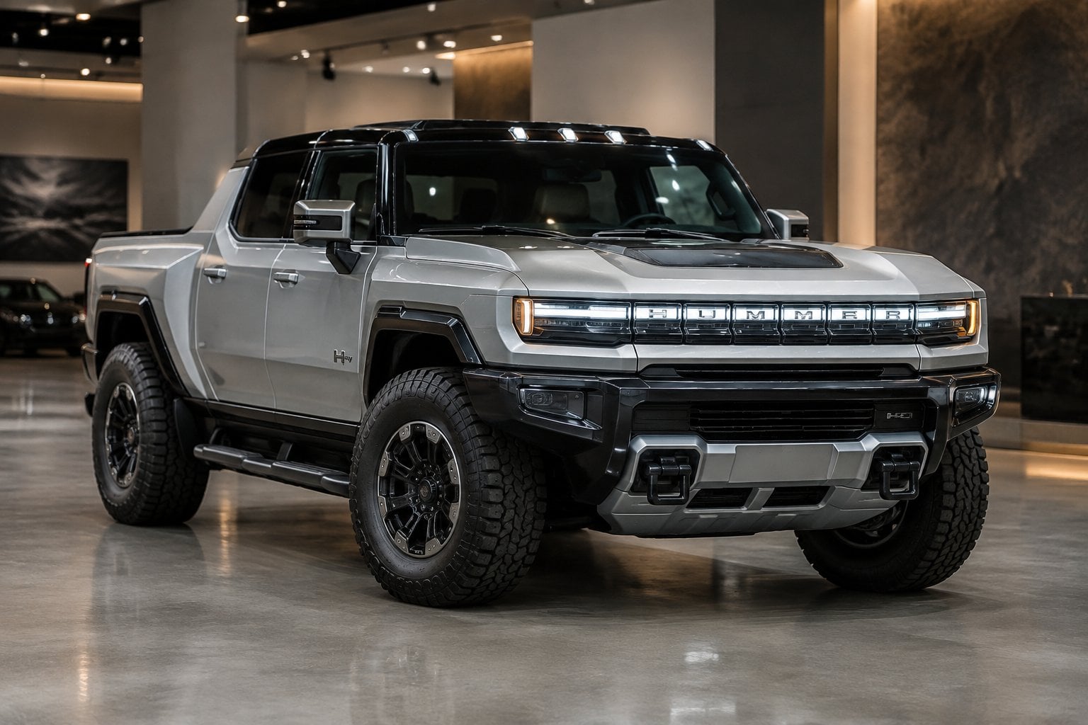 A GMC Hummer EV pickup displayed in an upscale showroom.